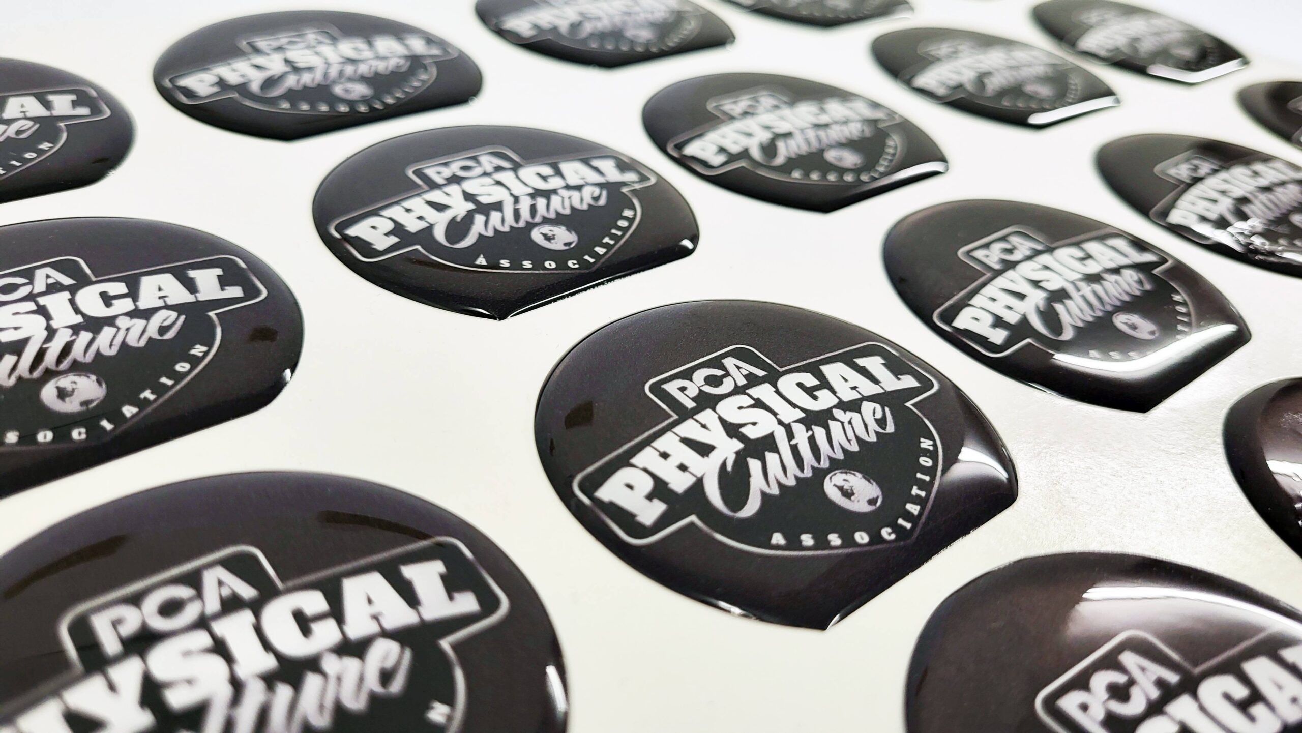 A selection of custom printed labels in various shapes and finishes