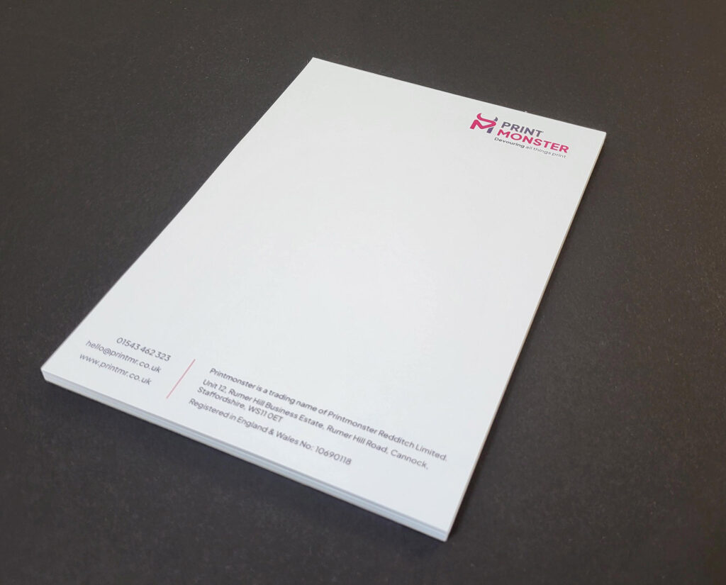 Branded notepad printing shown with custom designs and premium paper.