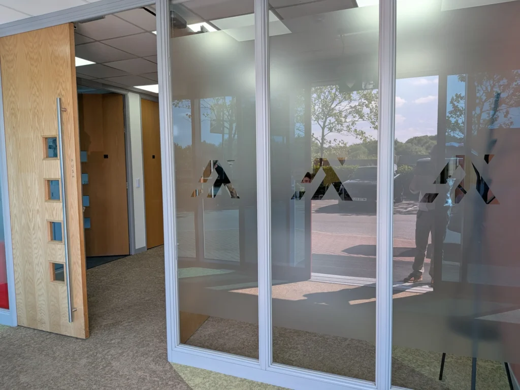 Axil office with frosted windows positioned opposite the entrance to the building in Cannock.