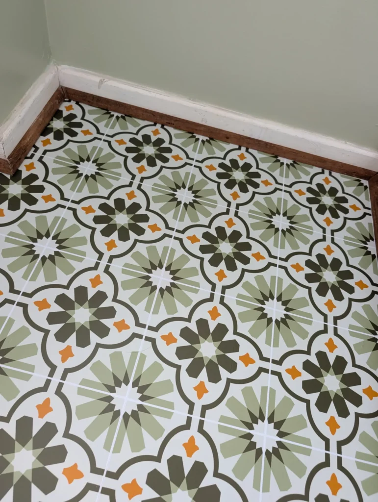 Printmonster fitting custom printed floor vinyl in a customer porch