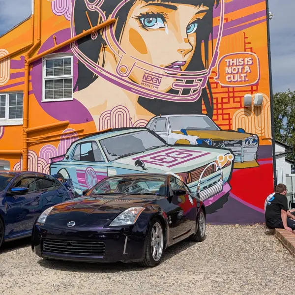 Side view of a Nissan 350Z finished in Midnight Purple vinyl