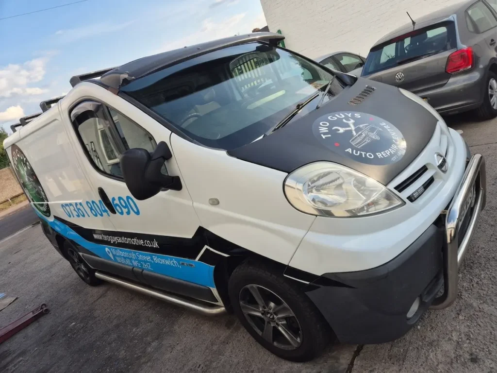Two Guys Automotive van with black, blue and white graphics supplied by Printmonster