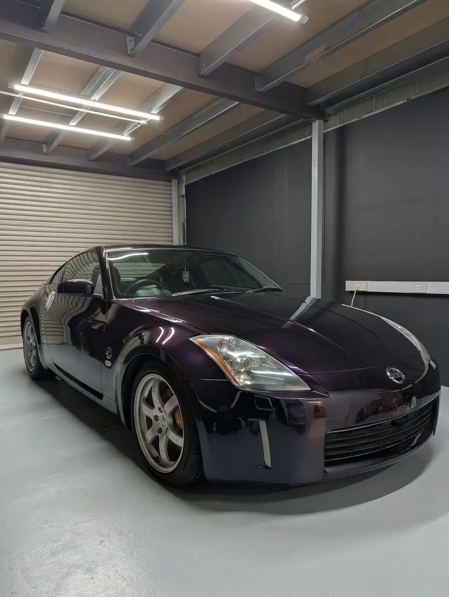 Nissan 350Z with a midnight purple colour change wrap by Printmonster
